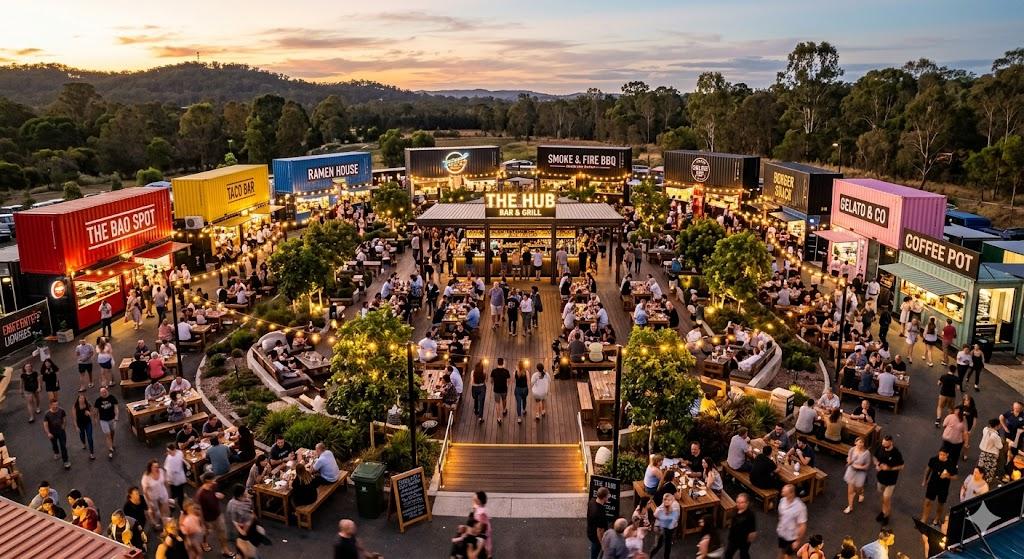 Food street with container-style eateries and night-time crowds